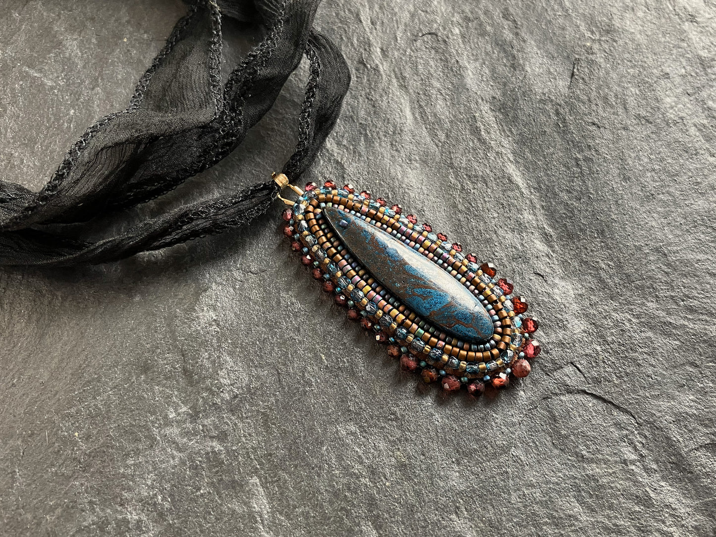 Azurite necklace pendant with red garnet beads