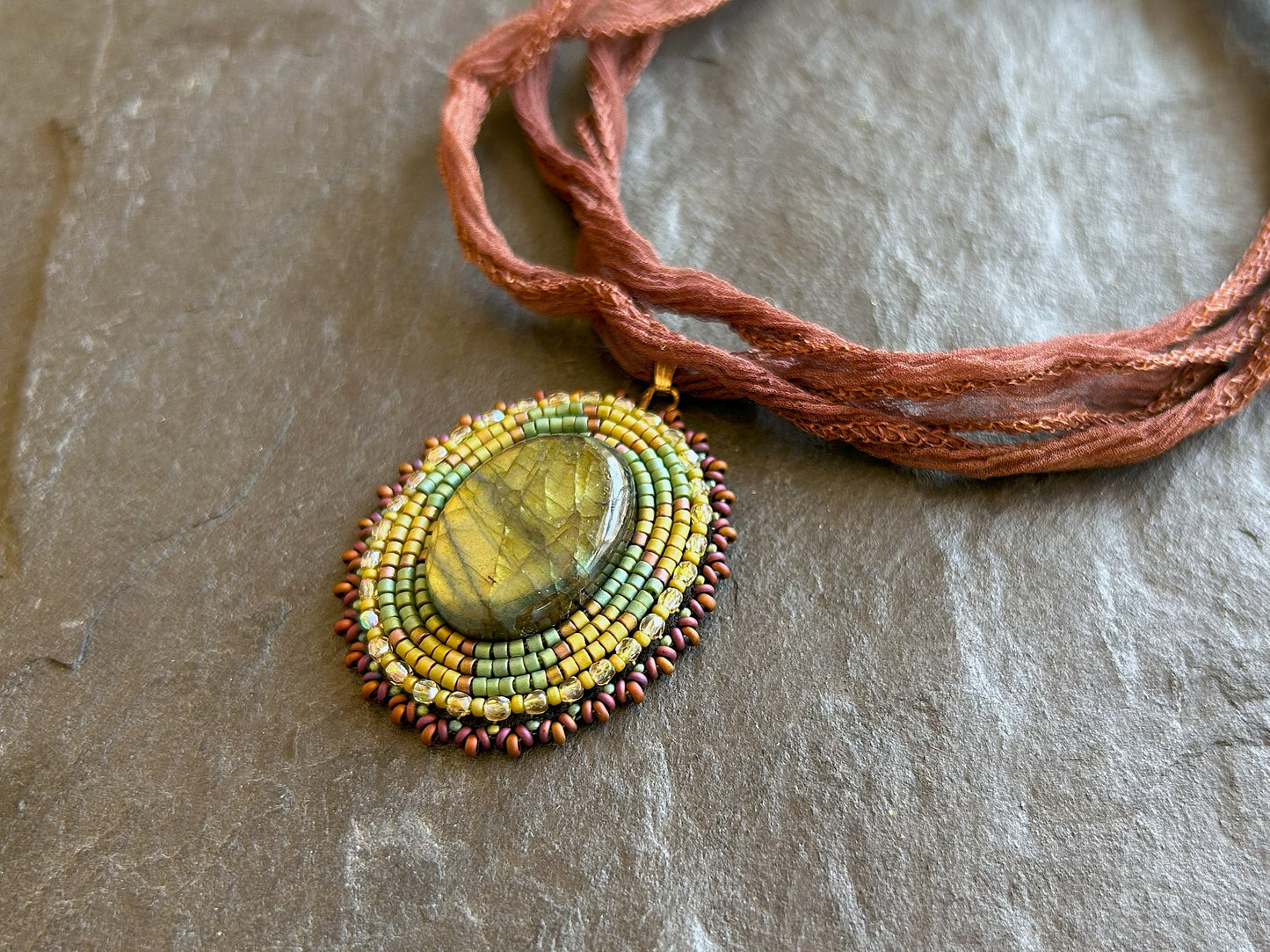 Iridescent labradorite necklace pendant with green fire