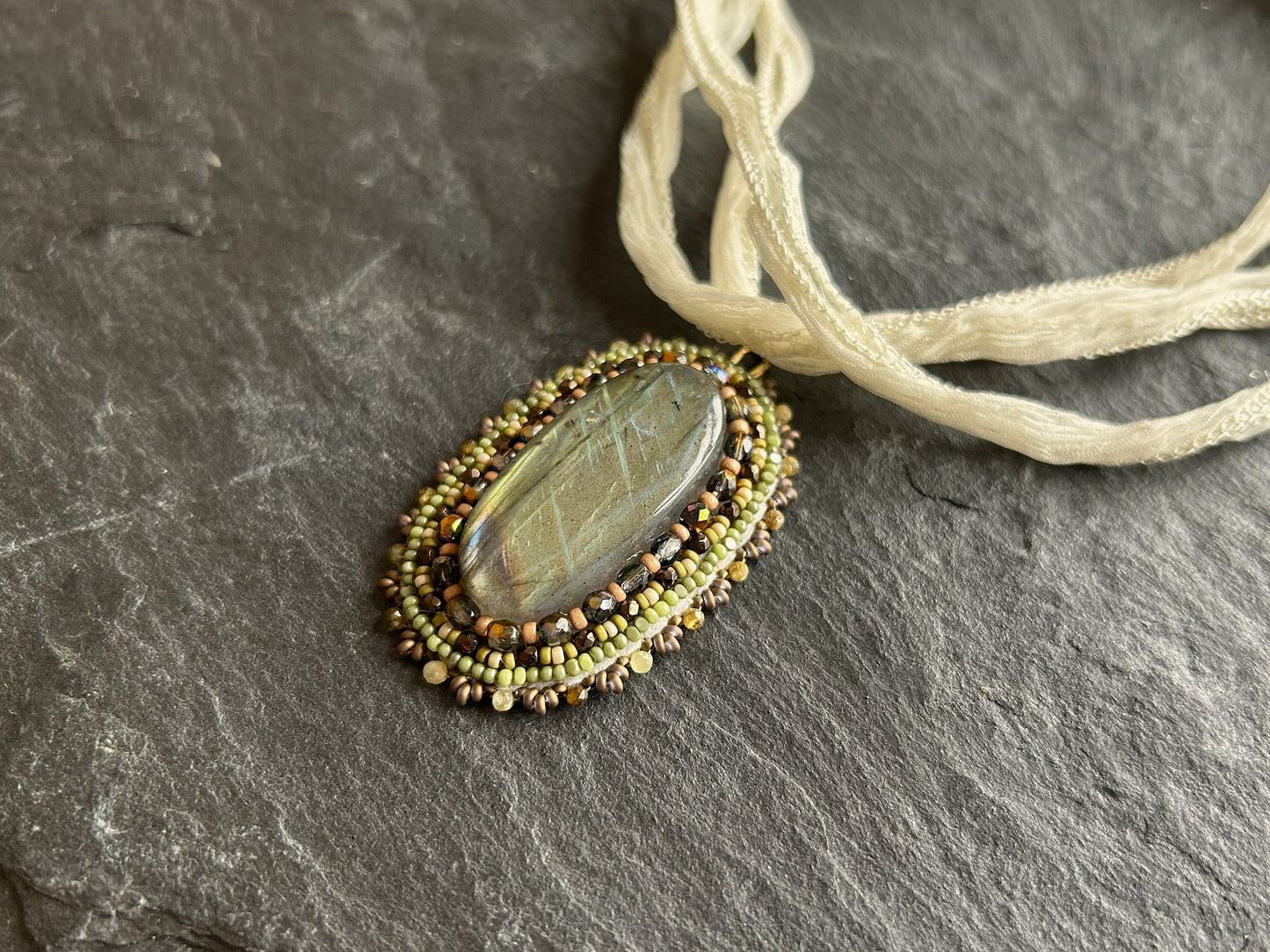 Iridescent labradorite necklace pendant in earth tones