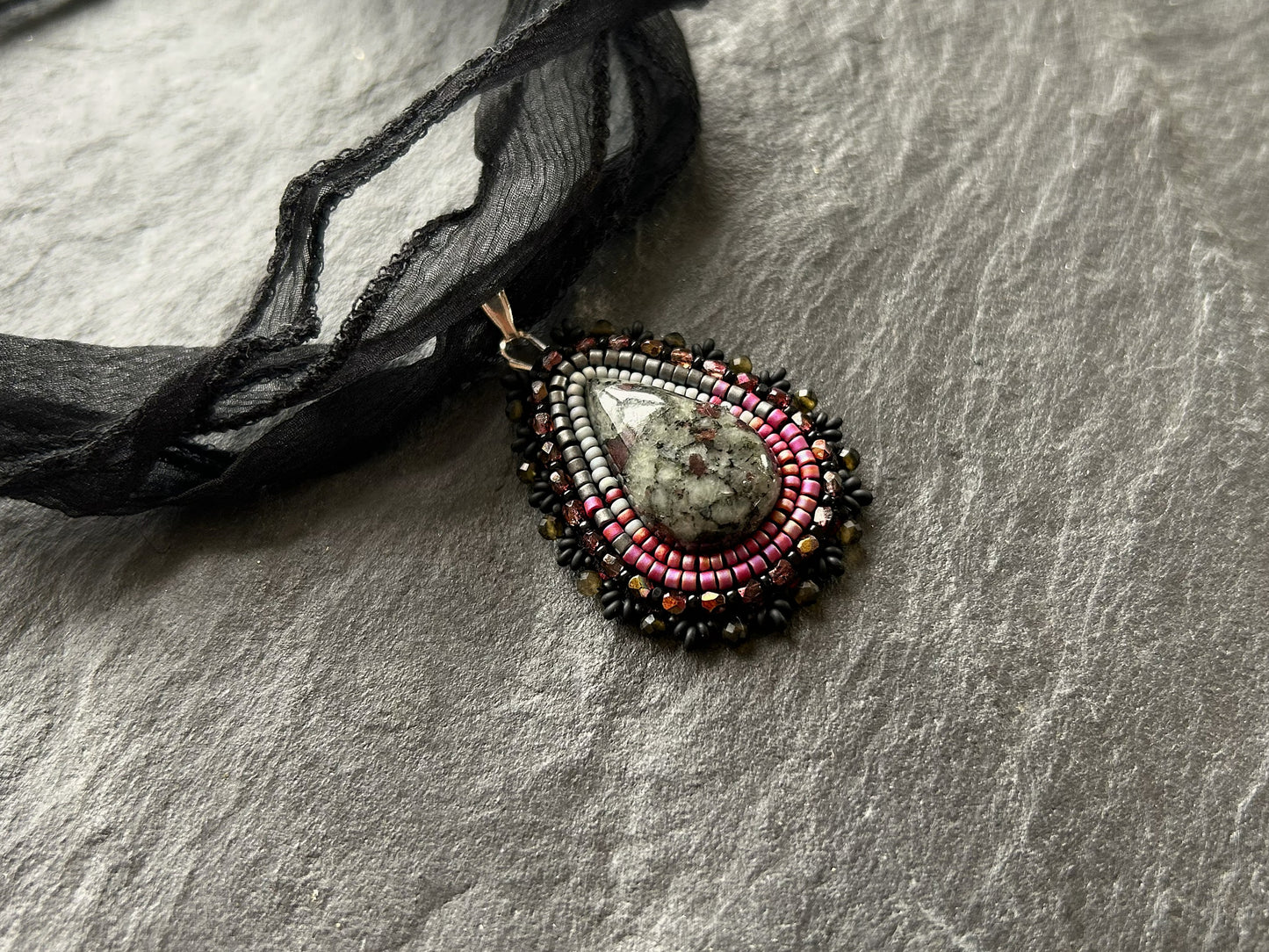 Eudialyte necklace pendant with obsidian beads