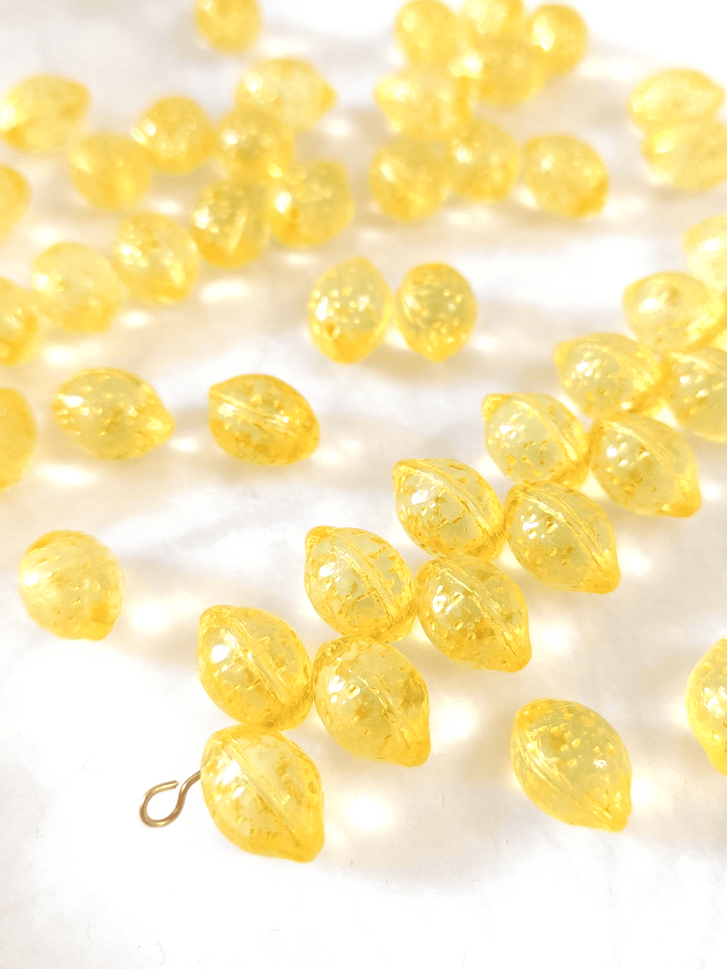 Lemon beads 10x14mm - yellow glitter