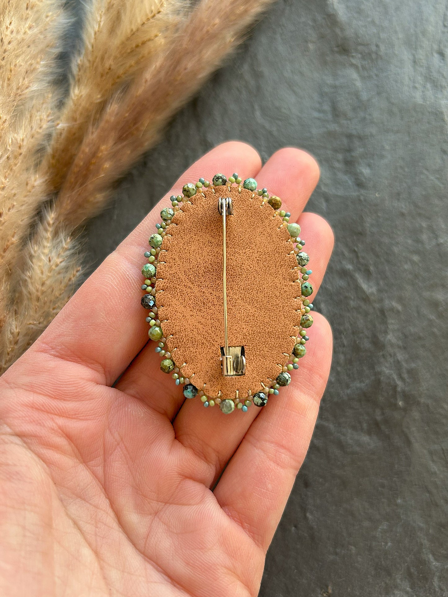 Fossil coral brooch with African turquoise