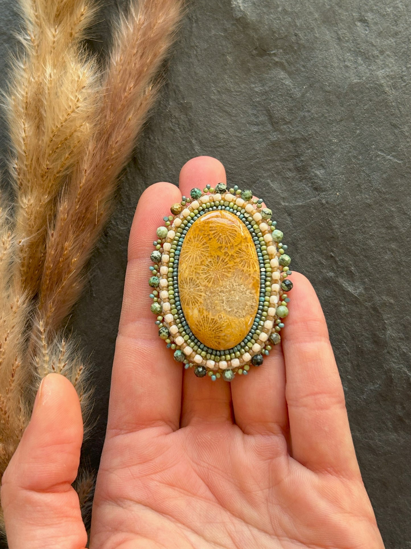 Fossil coral brooch with African turquoise