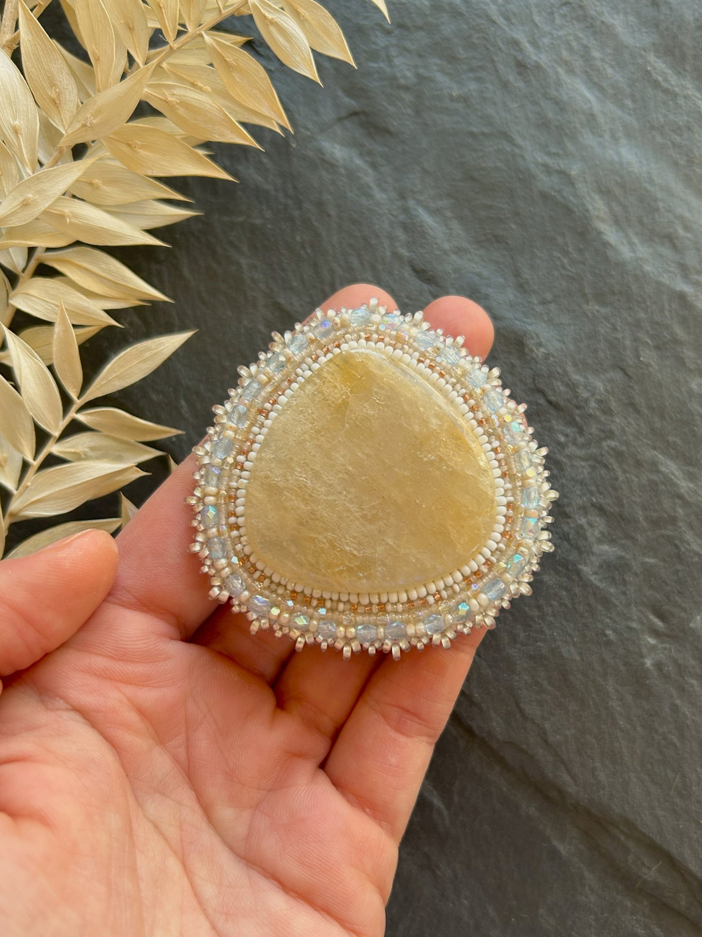 Belomorite brooch with light blue fire