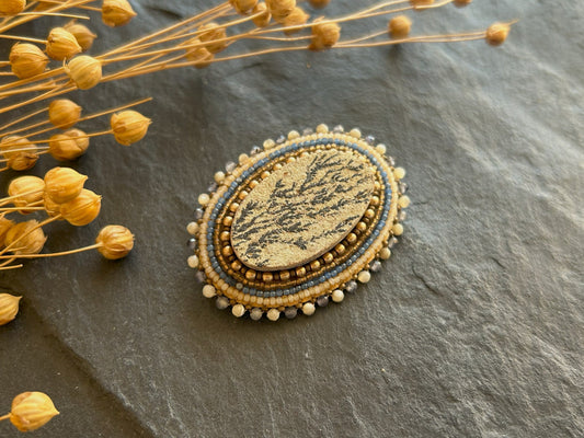 Dendritic psilomelane brooch with shell and water sapphire beads