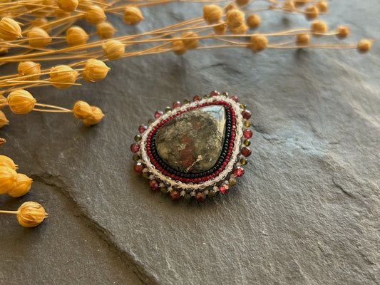 Eydialyte brooch with garnet and obsidian