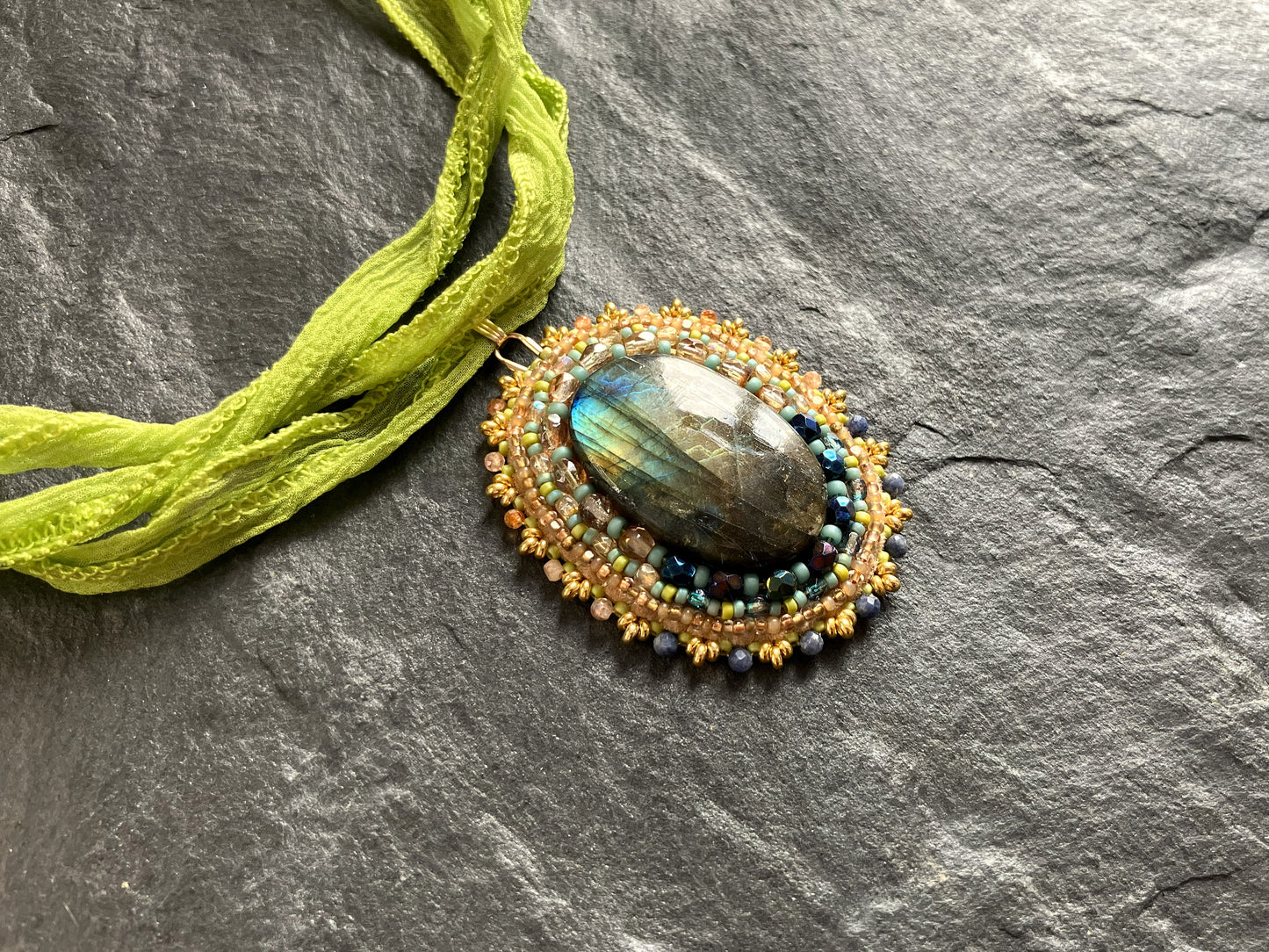 Fiery labradorite necklace pendant in spring colors