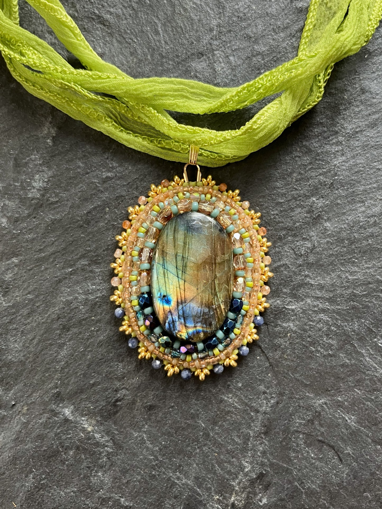 Fiery labradorite necklace pendant in spring colors