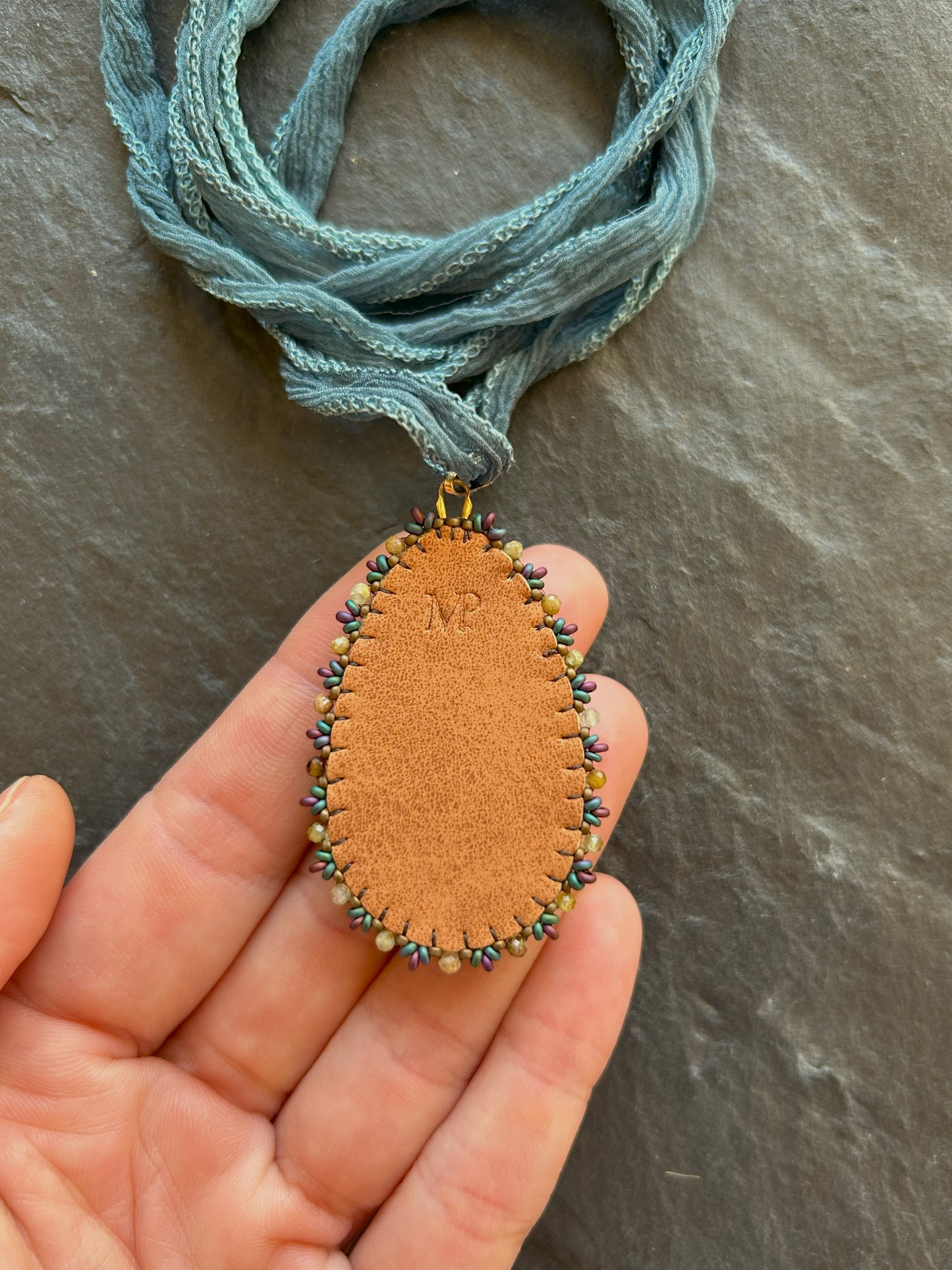Bronzite necklace pendant with garnet beads