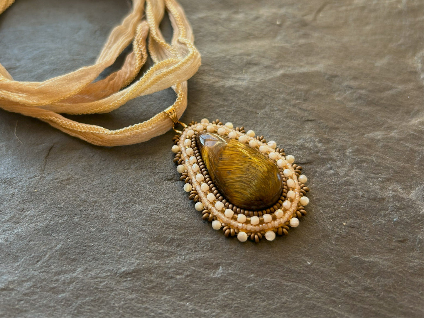 Tiger's eye necklace pendant with shell beads