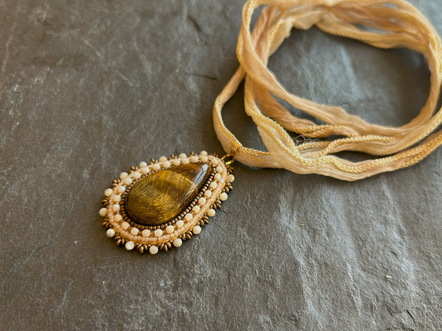 Tiger's eye necklace pendant with shell beads
