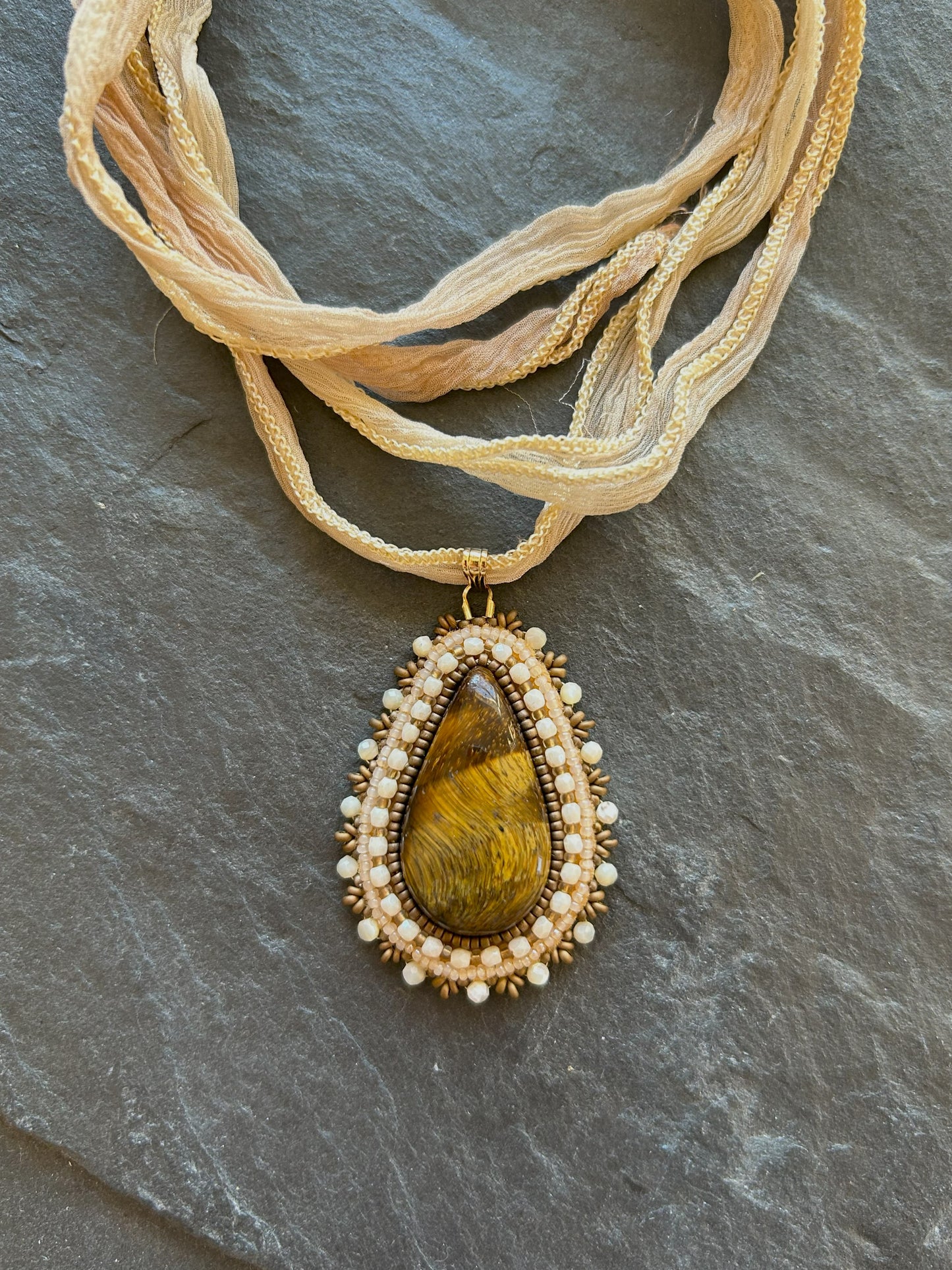 Tiger's eye necklace pendant with shell beads
