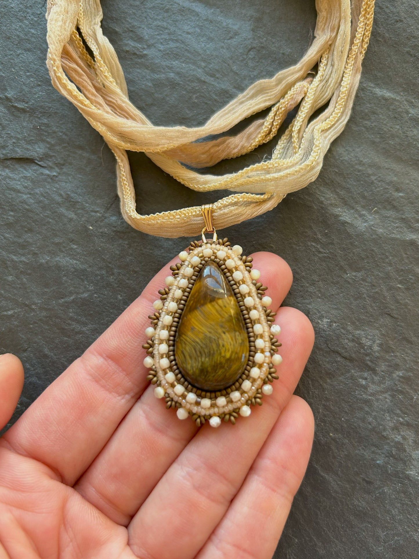 Tiger's eye necklace pendant with shell beads