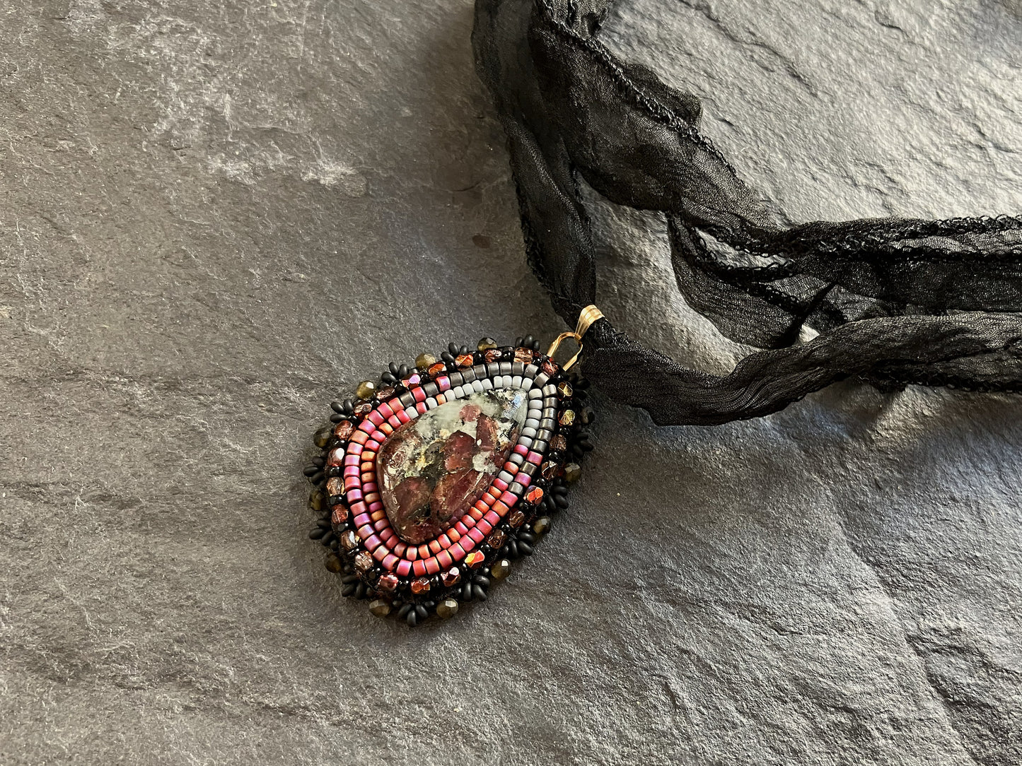 Eudialyte necklace pendant with obsidian beads