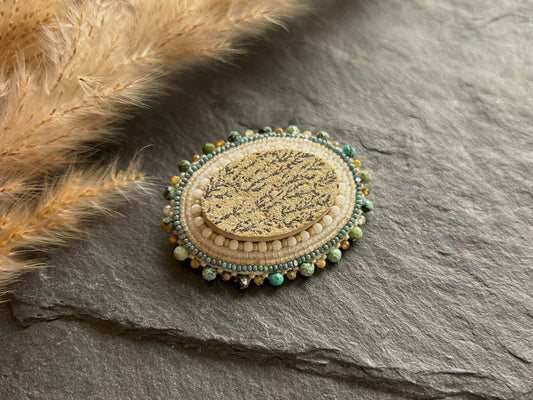 Dendritic psilomelane brooch with garnet and turquoise beads