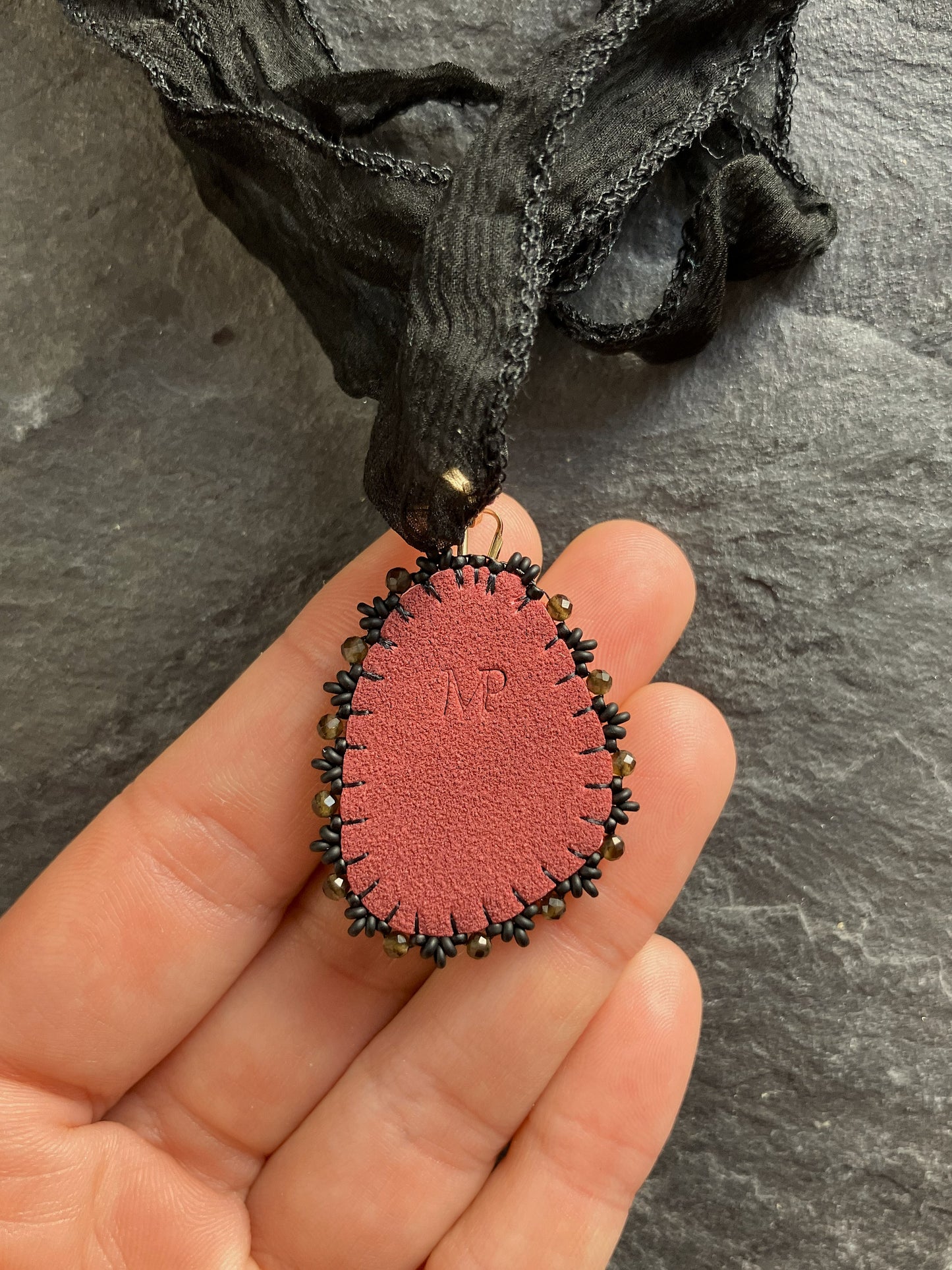 Eudialyte necklace pendant with obsidian beads