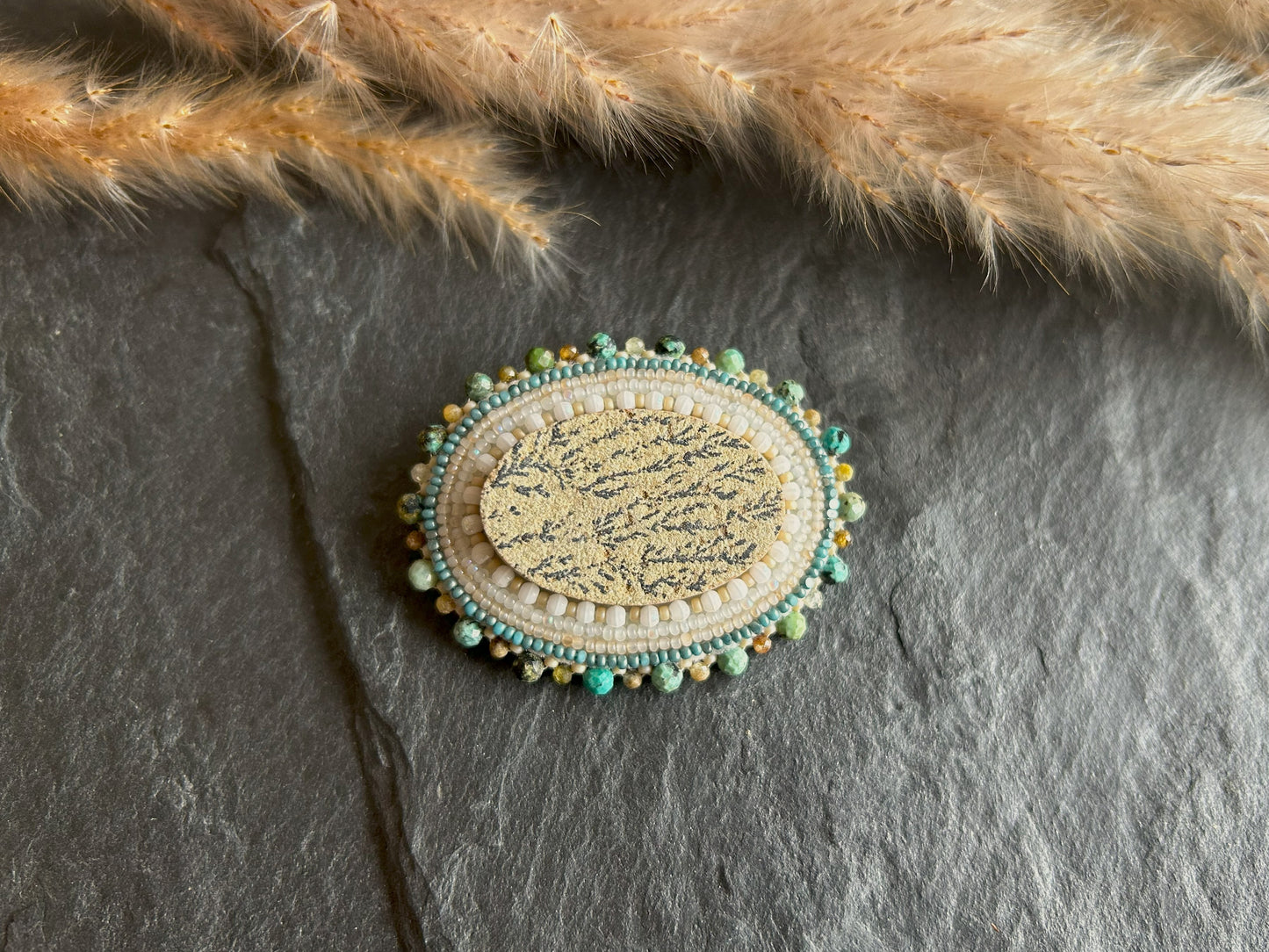 Dendritic psilomelane brooch with garnet and turquoise beads