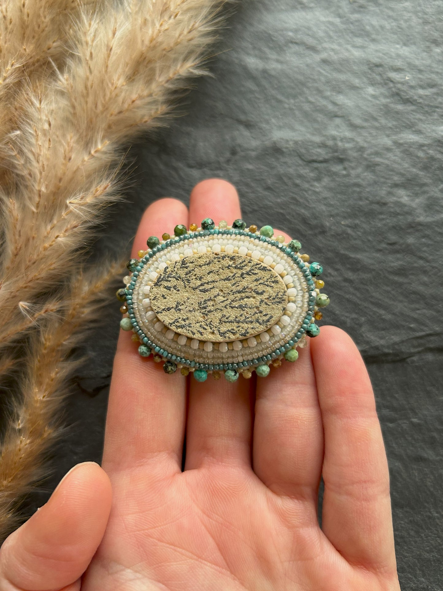 Dendritic psilomelane brooch with garnet and turquoise beads