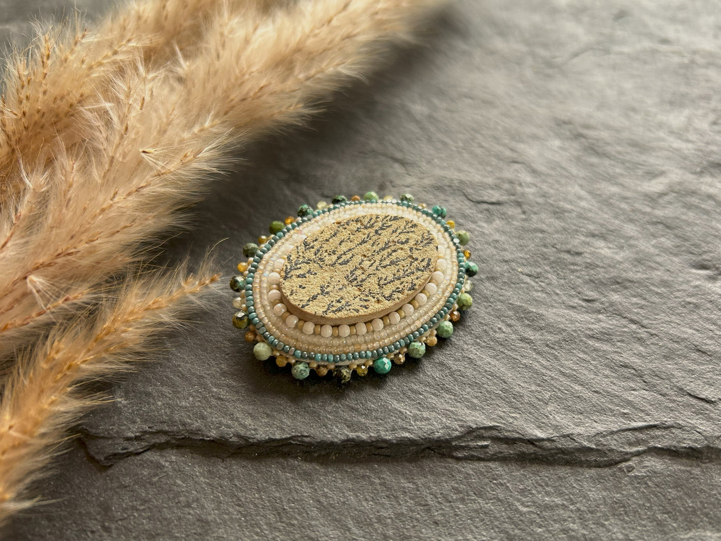 Dendritic psilomelane brooch with garnet and turquoise beads