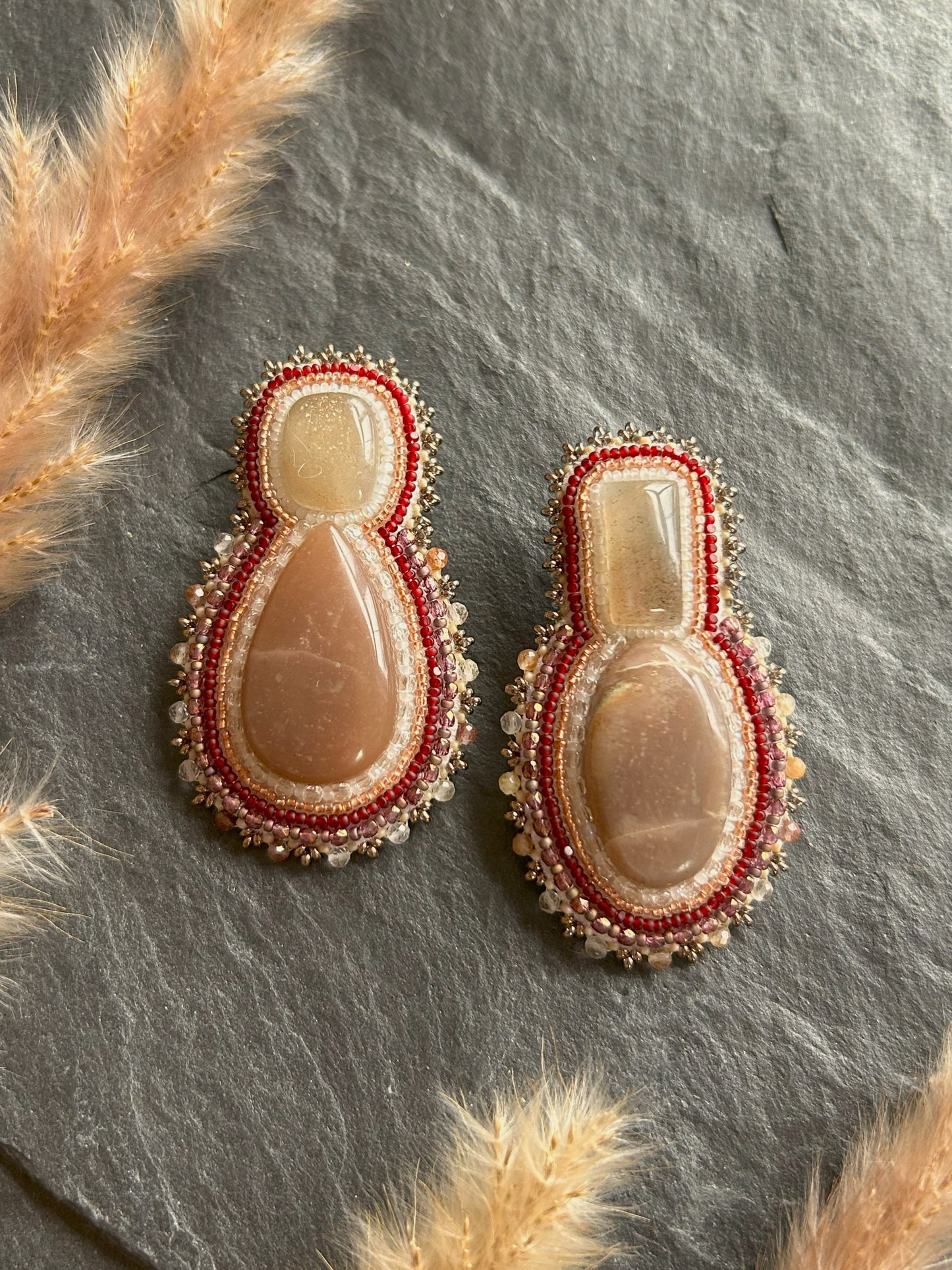 Mismatched earrings with peach moonstone