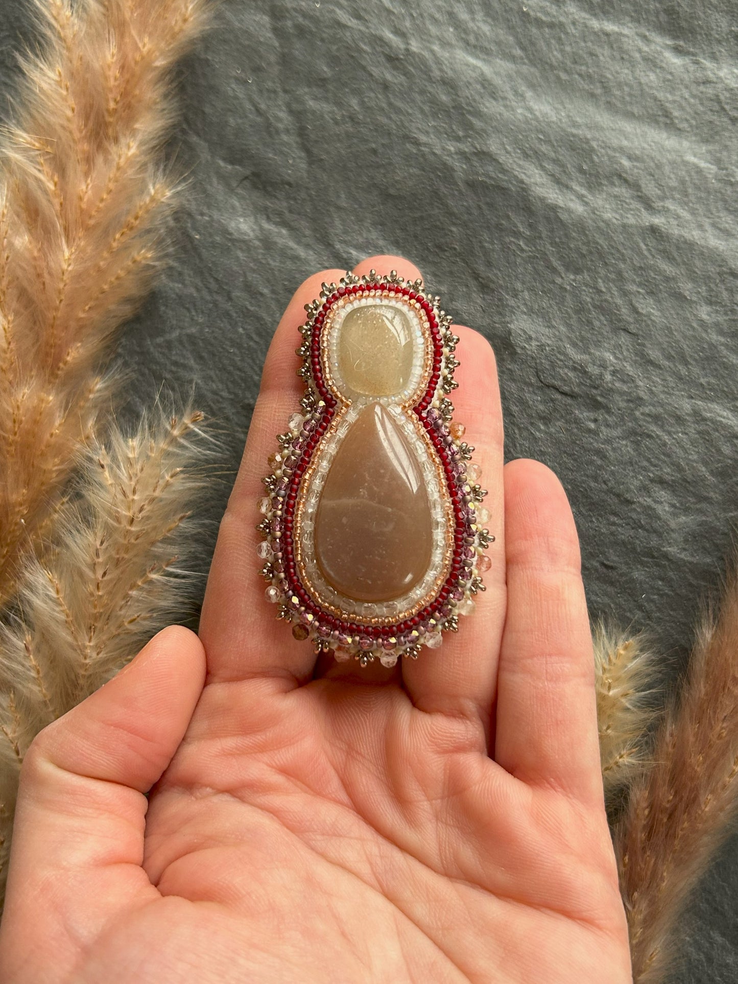 Mismatched earrings with peach moonstone