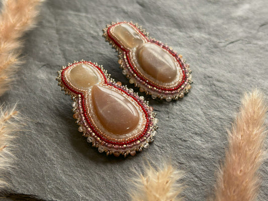 Mismatched earrings with peach moonstone