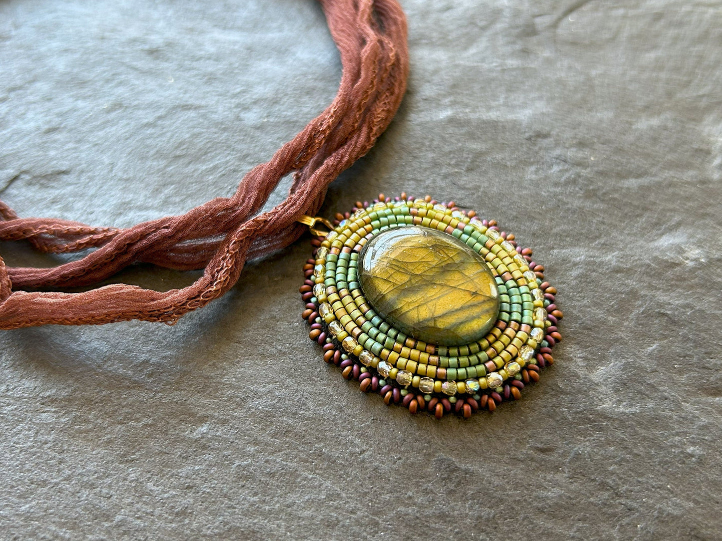 Iridescent labradorite necklace pendant with green fire