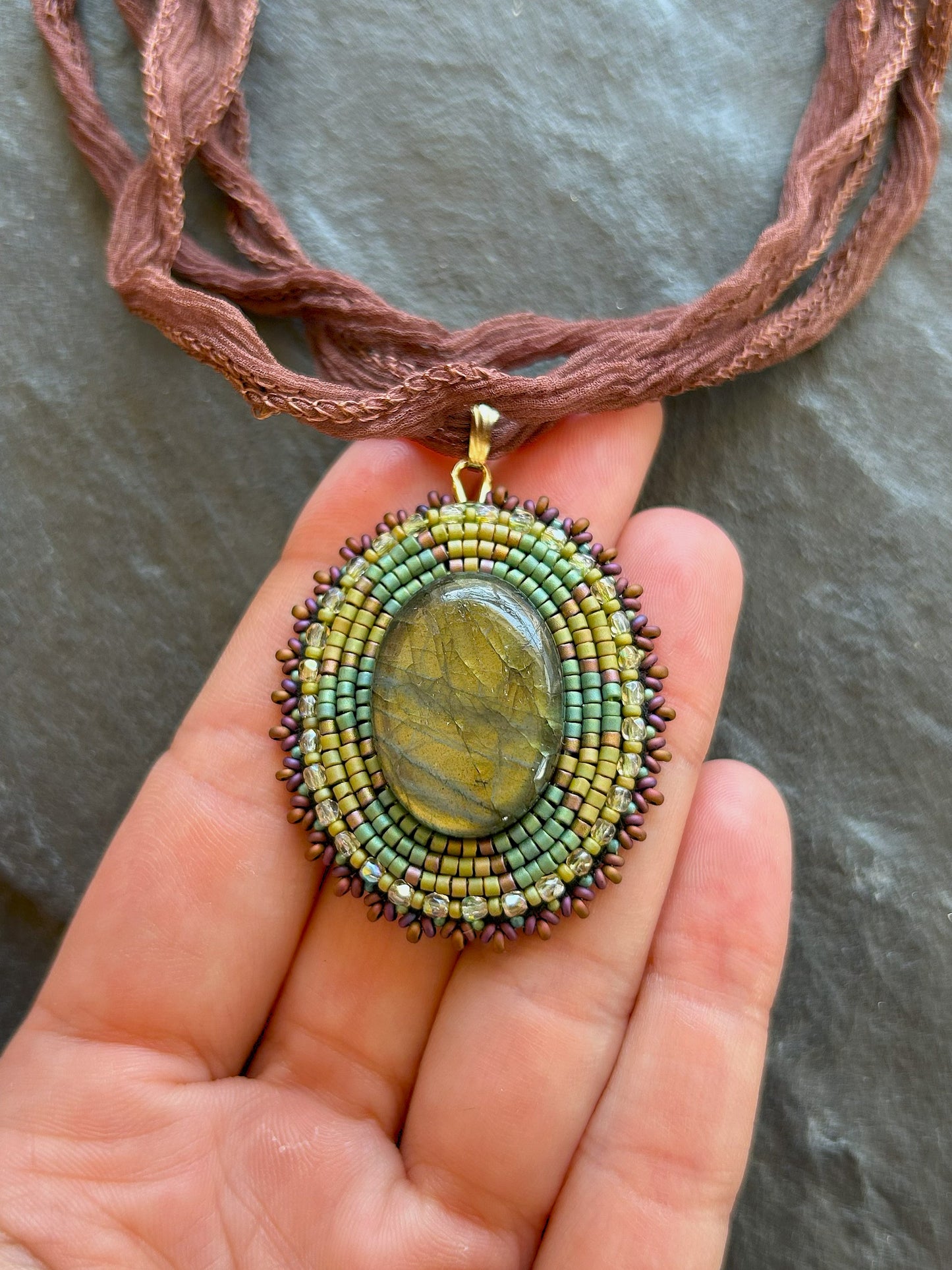 Iridescent labradorite necklace pendant with green fire
