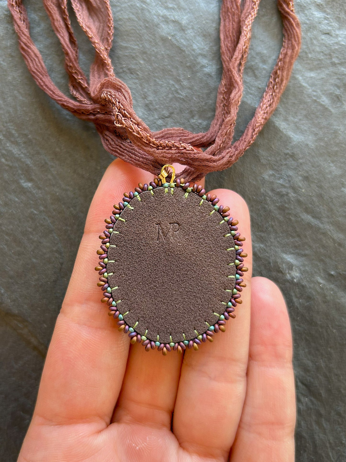 Iridescent labradorite necklace pendant with green fire