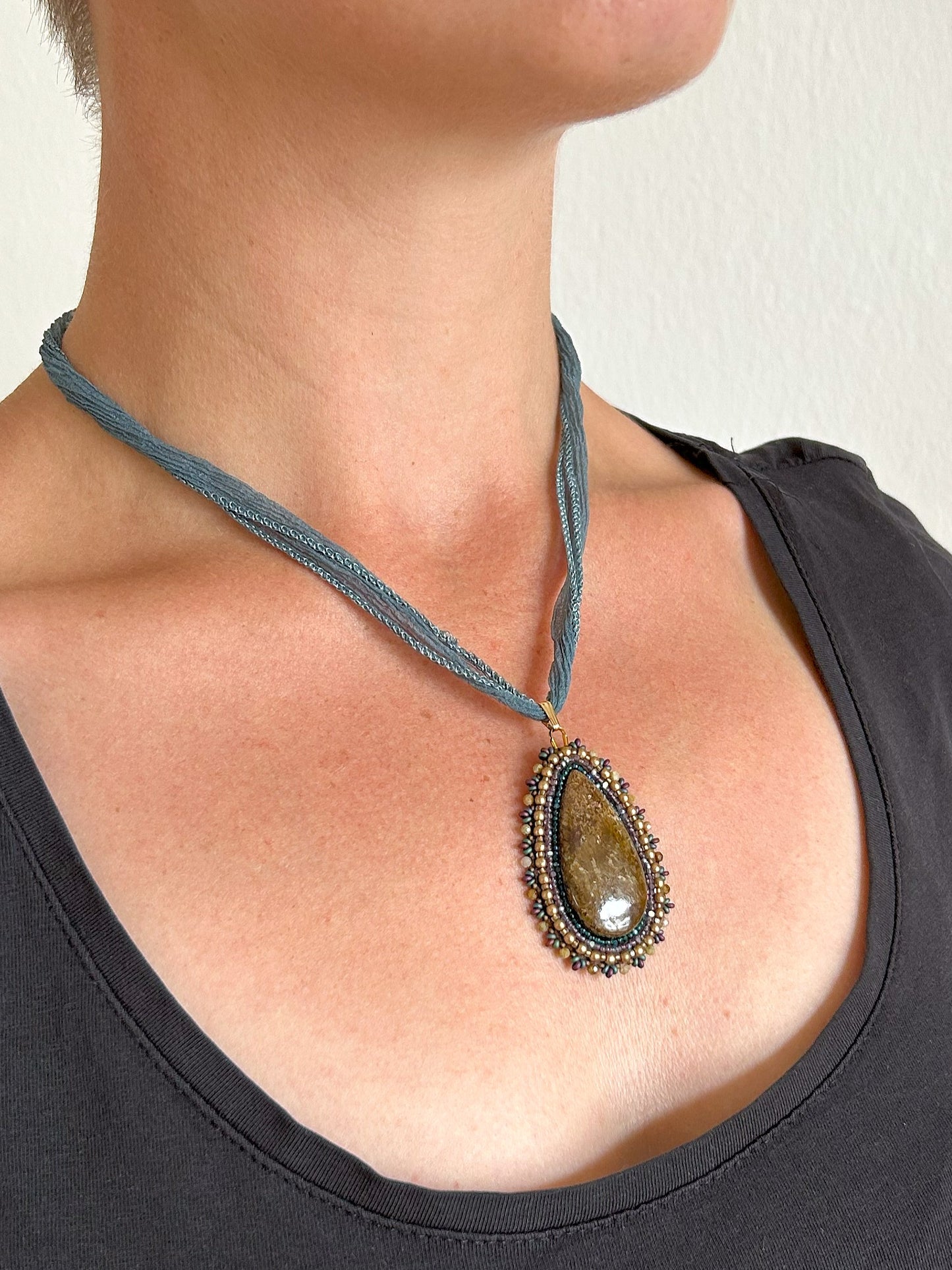 Bronzite necklace pendant with garnet beads