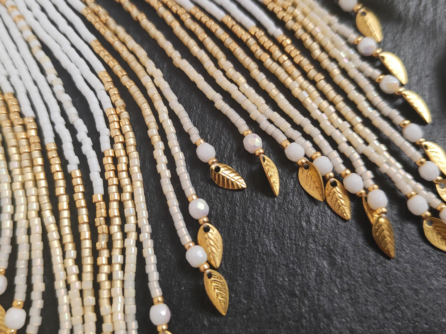 Fringe earrings "Faunus" with tribal-inspired design - white & gold