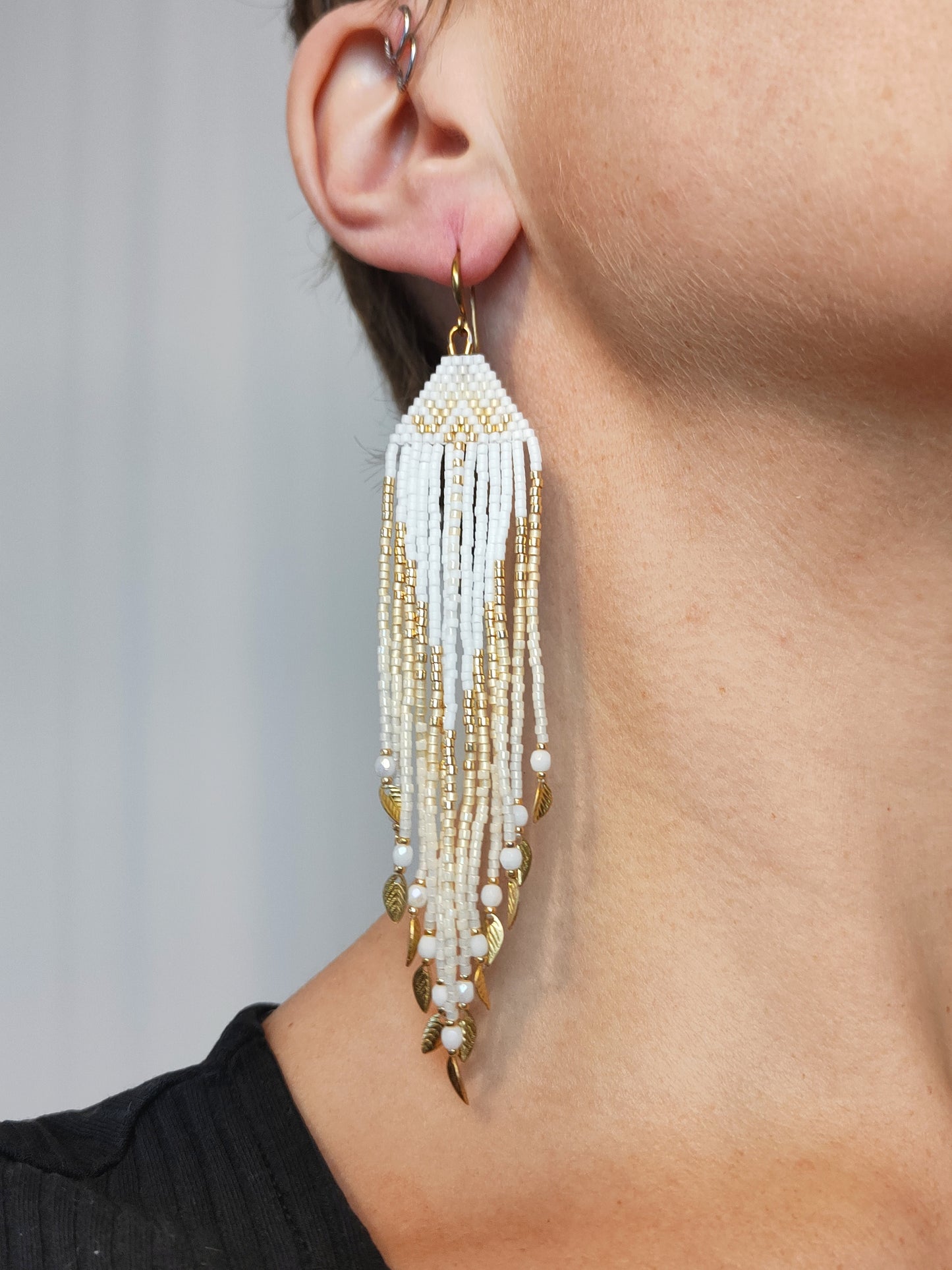 Fringe earrings "Faunus" with tribal-inspired design - white & gold