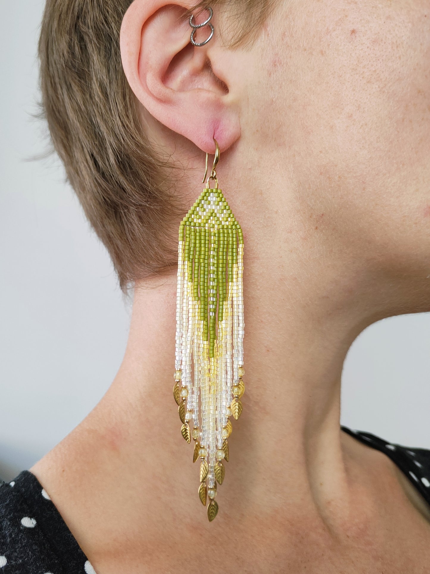 Fringe earrings "Faunus" with tribal-inspired design - green & white