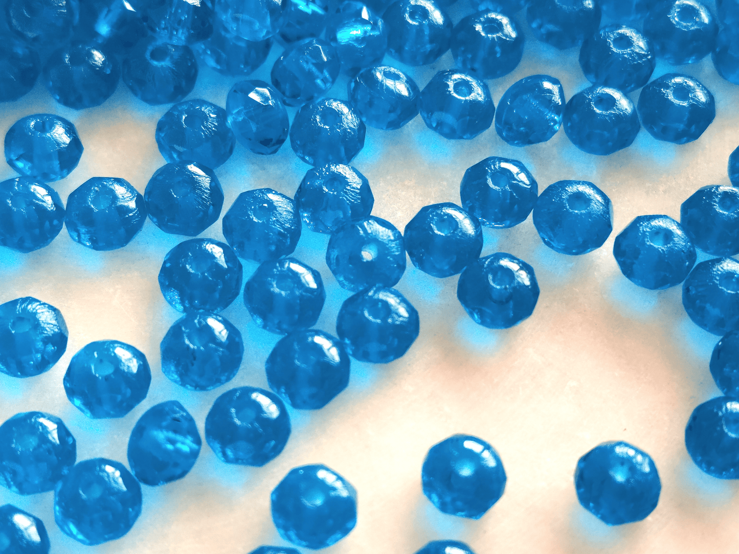 Faceted rondelle beads 3x5mm - dark Caribbean blue