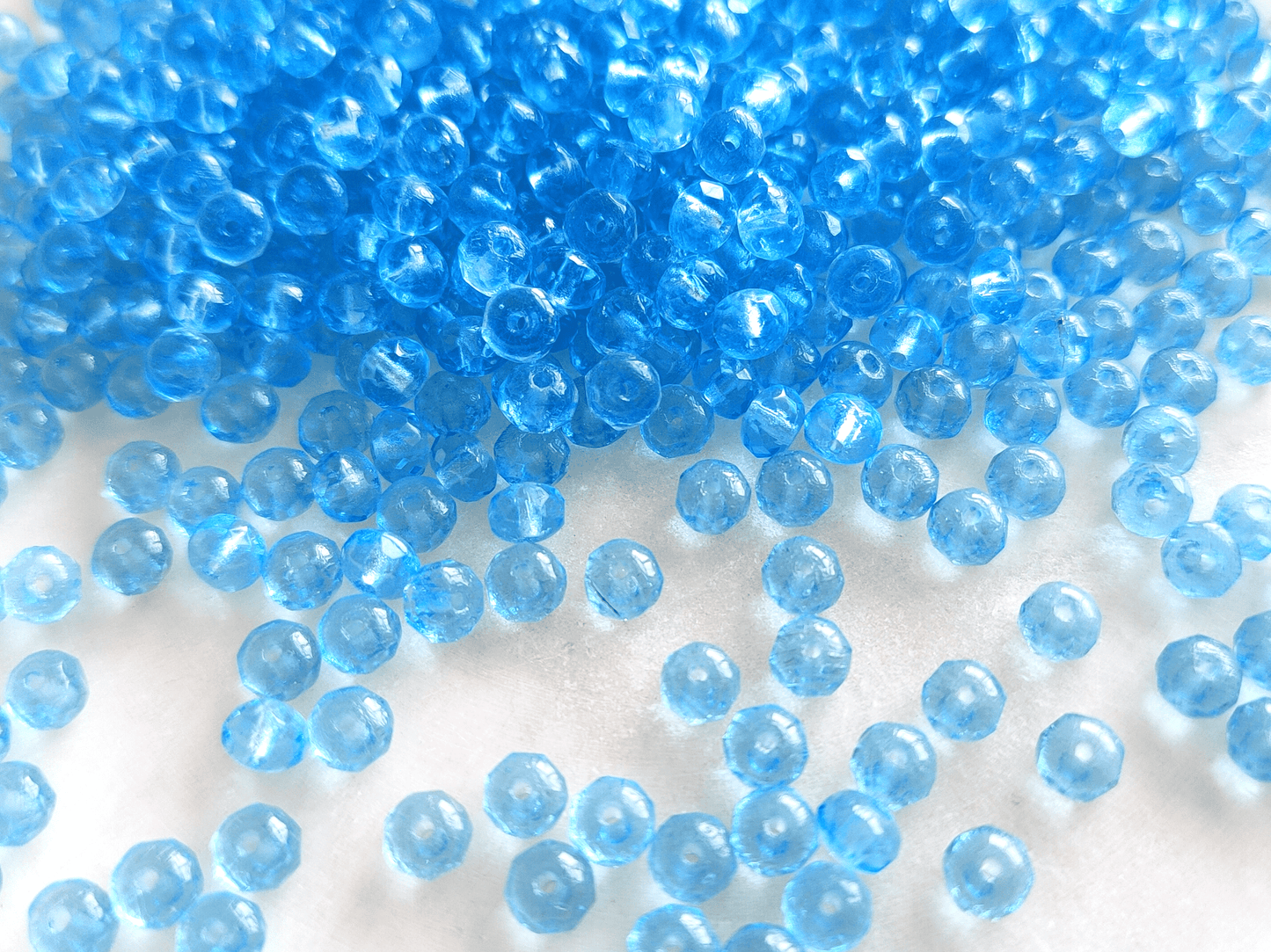 Faceted rondelle beads 3x5mm - light Caribbean blue