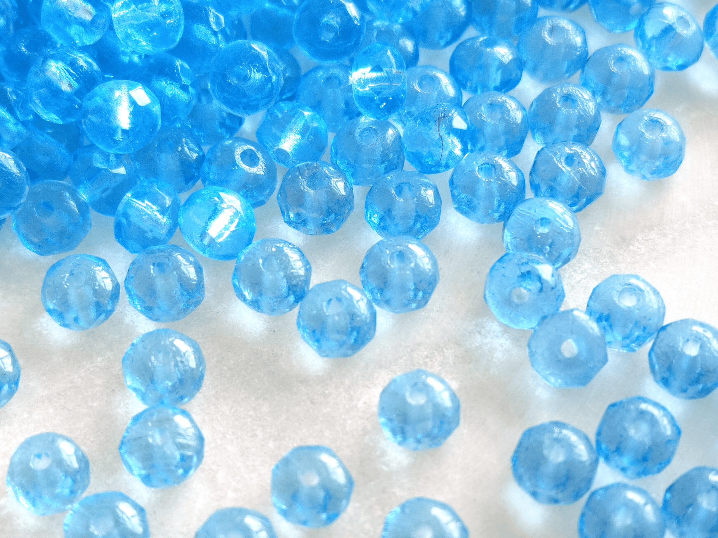 Faceted rondelle beads 3x5mm - light Caribbean blue