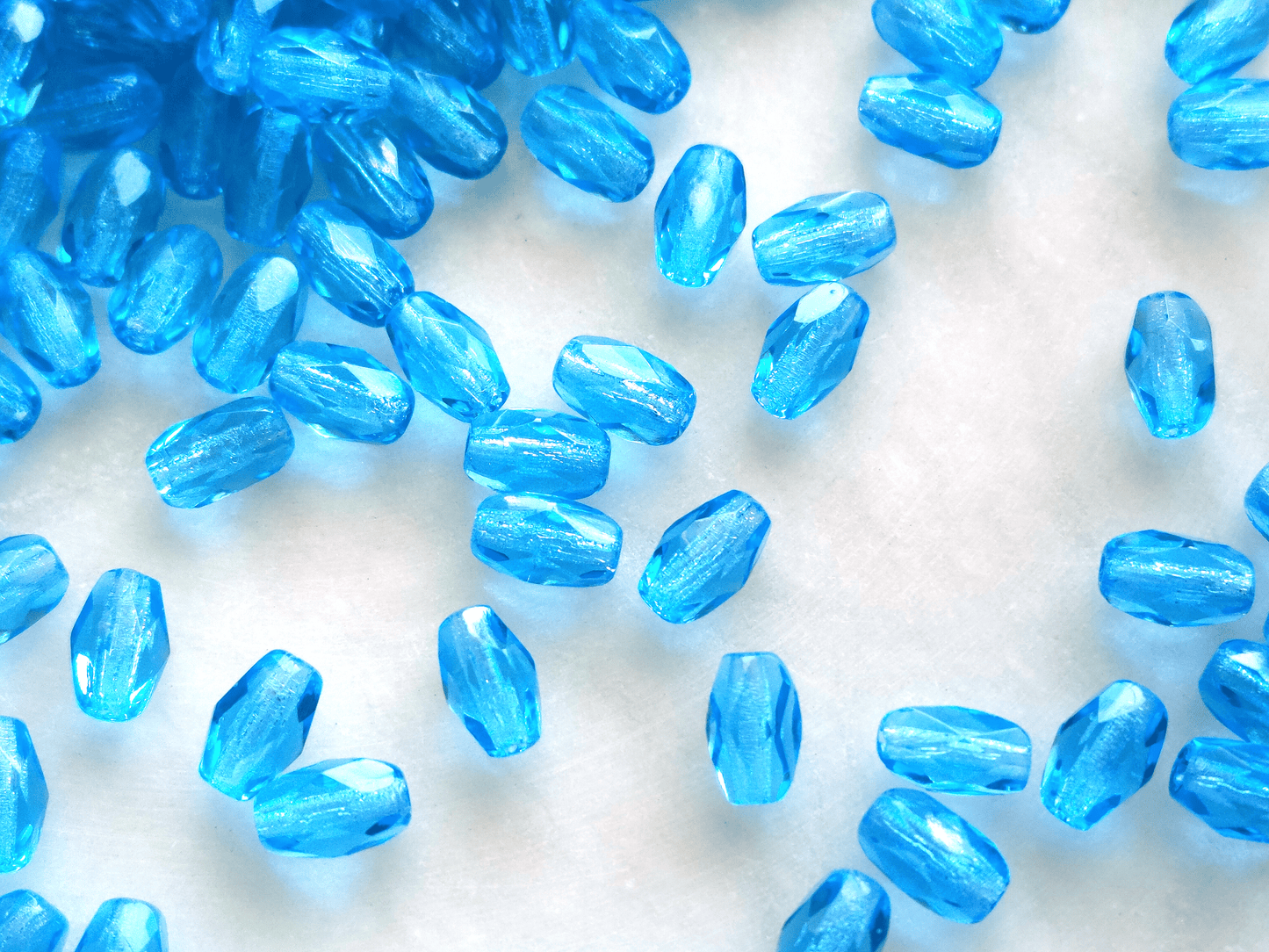 Faceted olive beads 4x6mm - Caribbean blue