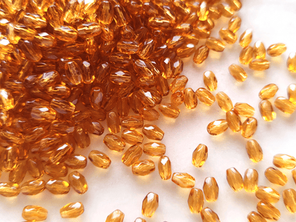 Faceted olive beads 4x6mm - warm orange