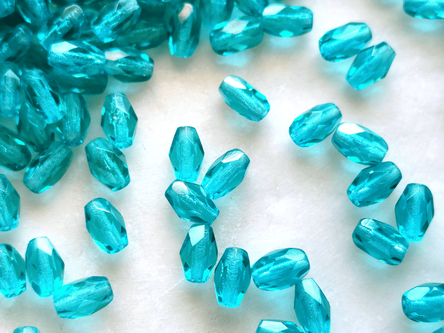 Faceted olive beads 4x6mm - turquoise