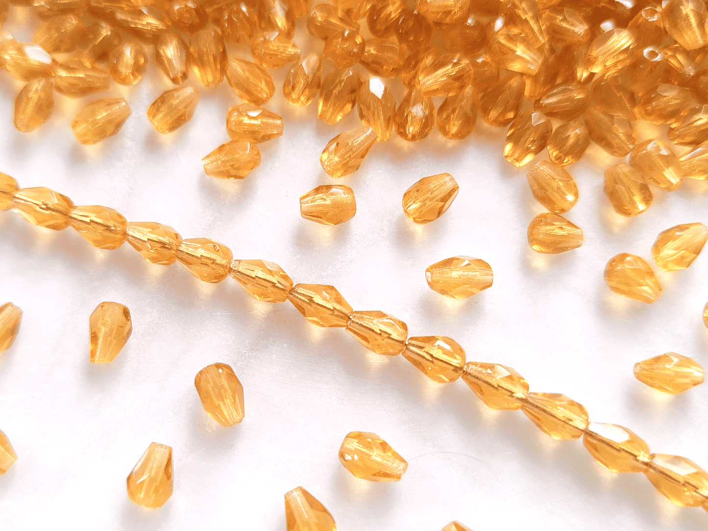 Fire-polished drop beads 7x5mm - honey