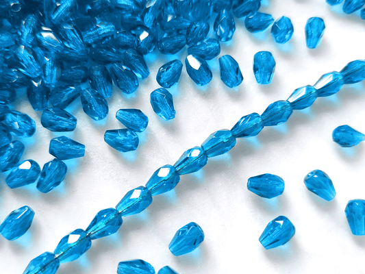 Fire-polished drop beads 7x5mm - dark Caribbean blue