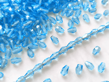 Fire-polished drop beads 7x5mm - light blue