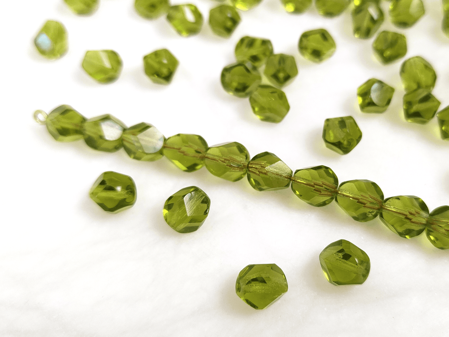 Faceted nugget beads 8x6mm - warm green