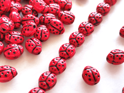 Lady bug beads 10x7mm - red & black