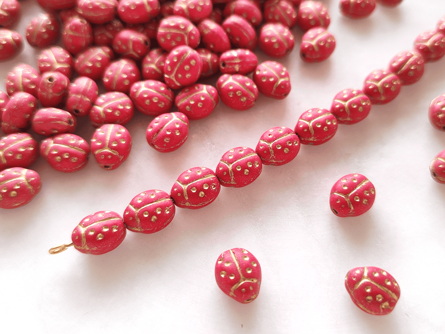 Lady bug beads 10x7mm - matt red & gold