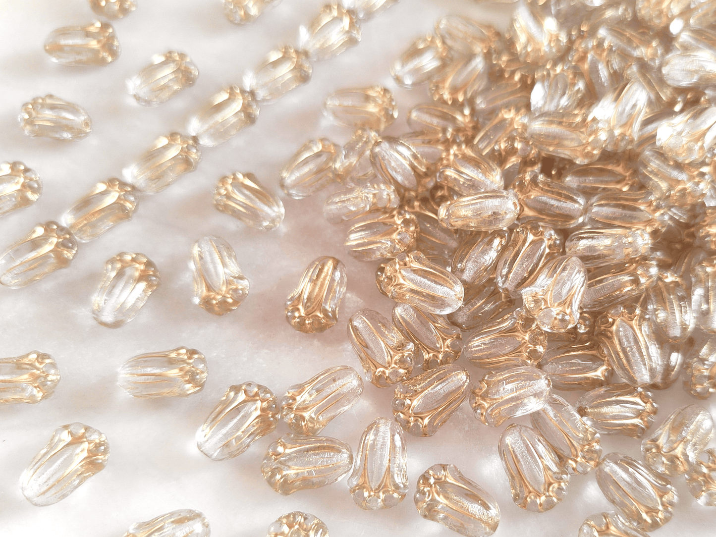 Tulip beads 12x8mm - colorless & gold