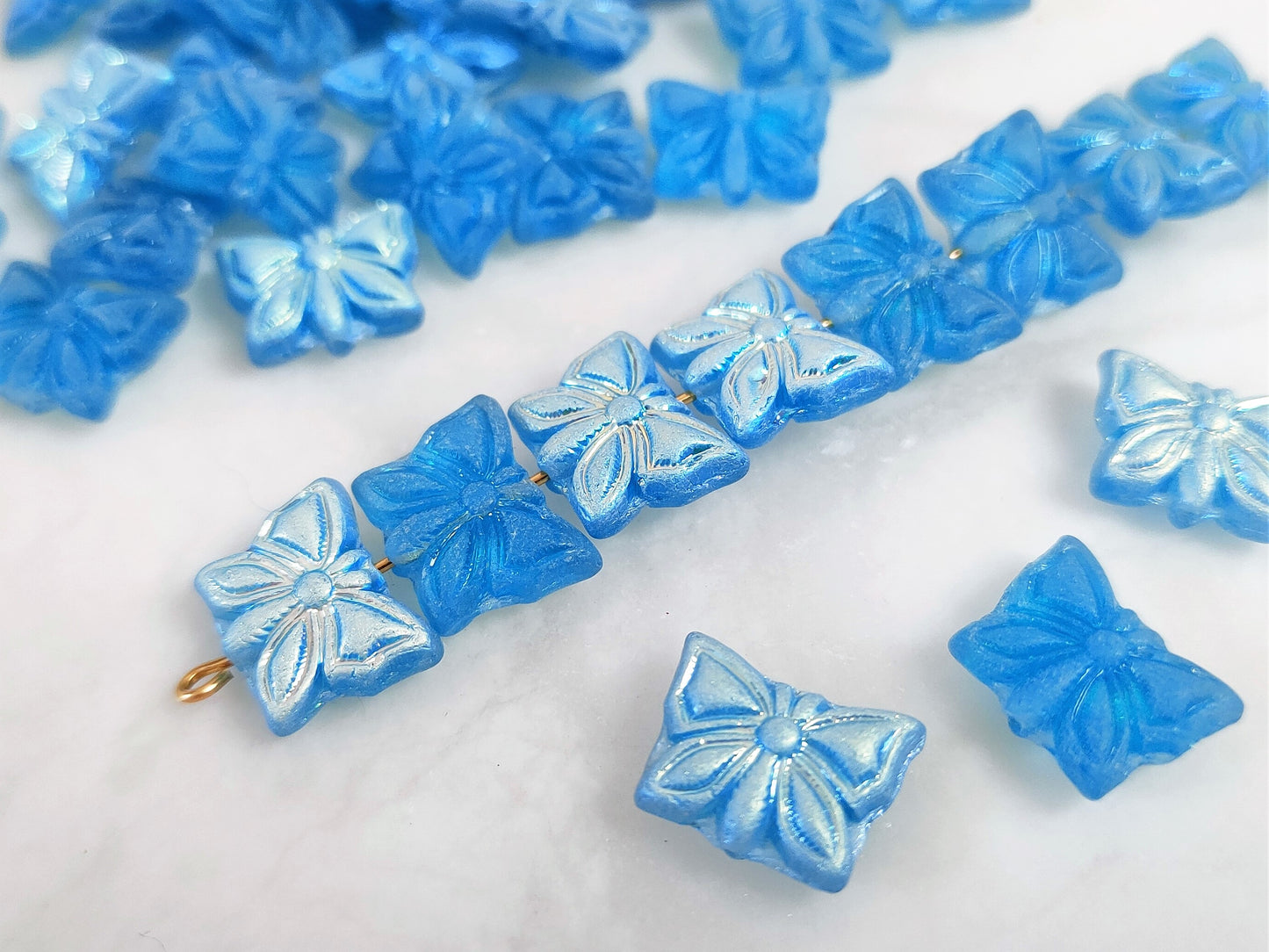 Butterfly beads 15x12mm - Caribbean blue iris