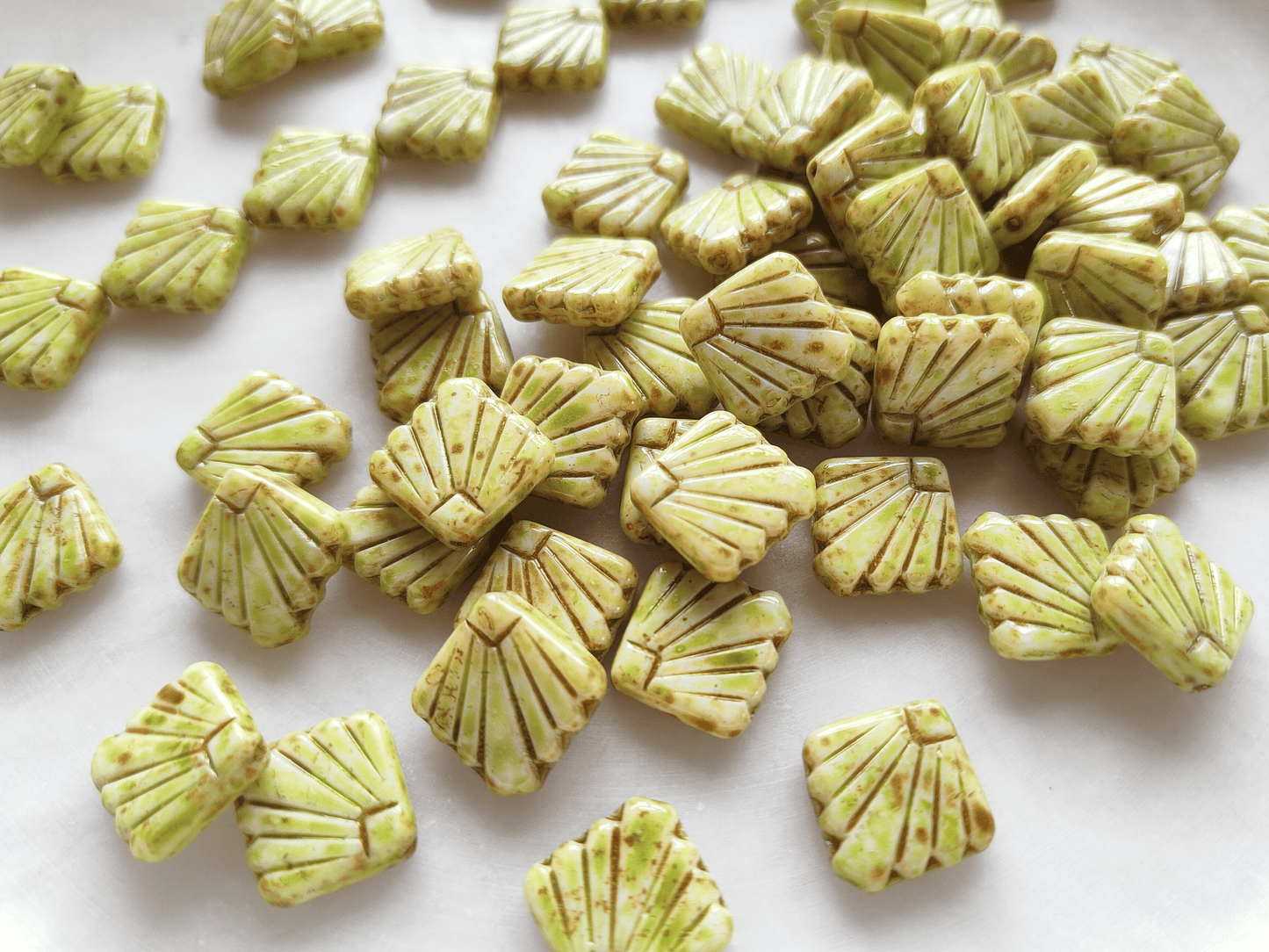 Fan ornament beads 17mm - light green & brown speckled