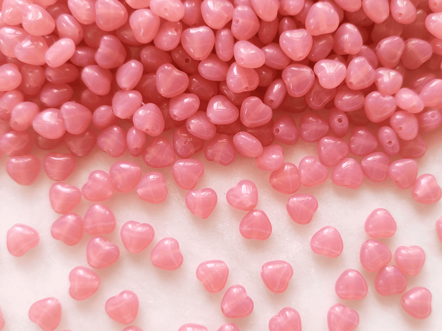Herzen 6mm - milchig Rosa