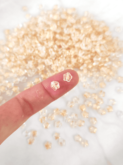 Star beads 6mm - colorless & gold